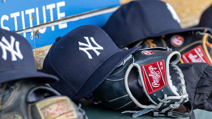 Apr 7, 2025; Detroit, Michigan, USA; New York Yankees baseball hats and gloves in the dugout out in the eighth inning against the Detroit Tigers at Comerica Park. Mandatory Credit: David Reginek-Imagn Images