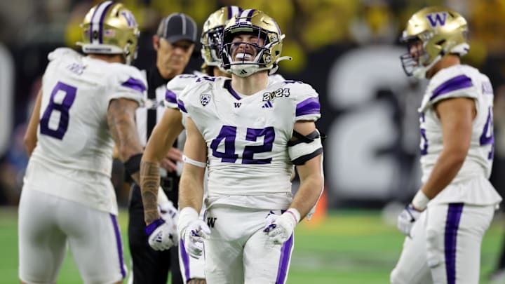Jan 8, 2024; Houston, TX, USA; Washington Huskies linebacker Carson Bruener (42) reacts after a play against the Michigan Wolverines during the third quarter in the 2024 College Football Playoff national championship game at NRG Stadium. Mandatory Credit: Thomas Shea-Imagn Images