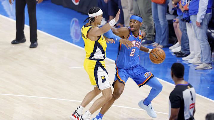 Jun 22, 2025; Oklahoma City, Oklahoma, USA; Oklahoma City Thunder guard Shai Gilgeous-Alexander (2) controls the ball againstIndiana Pacers guard Andrew Nembhard (2) during the first half of game seven of the 2025 NBA Finals at Paycom Center. Mandatory Credit: Alonzo Adams-Imagn Images Jun 22, 2025; Oklahoma City, Oklahoma, USA; Oklahoma City Thunder guard Shai Gilgeous-Alexander (2) controls the ball againstIndiana Pacers guard Andrew Nembhard (2) during the first half of game seven of the 2025 NBA Finals at Paycom Center. Mandatory Credit: Alonzo Adams-Imagn Images
