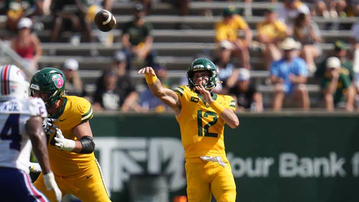 Sep 19, 2026; Waco, Texas, USA; Baylor Bears quarterback Nate Bennett (12) throws a touchdown pass to Baylor Bears wide receiver Louis Brown IV (4) (not pictured) during the first half against the Louisiana Tech Bulldogs at McLane Stadium. Mandatory Credit: Chris Jones-Imagn Images Sep 19, 2026; Waco, Texas, USA; Baylor Bears quarterback Nate Bennett (12) throws a touchdown pass to Baylor Bears wide receiver Louis Brown IV (4) (not pictured) during the first half against the Louisiana Tech Bulldogs at McLane Stadium. Mandatory Credit: Chris Jones-Imagn Images