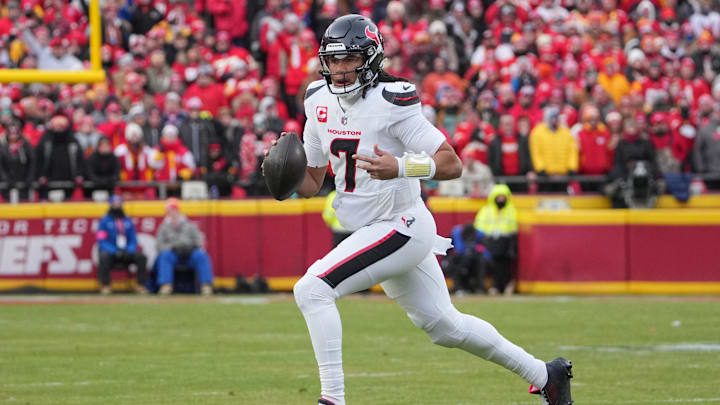 Jan 18, 2025; Kansas City, Missouri, USA; Houston Texans quarterback C.J. Stroud (7) scrambles in the backfield against the Kansas City Chiefs during the first half of a 2025 AFC divisional round game at GEHA Field at Arrowhead Stadium. Mandatory Credit: Denny Medley-Imagn Images