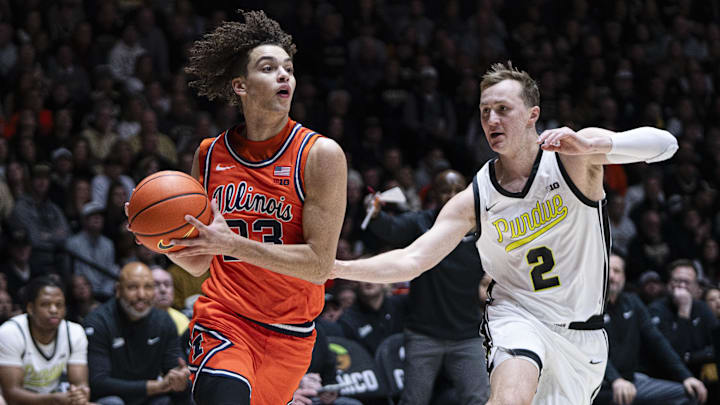 Illinois Fighting Illini guard Keaton Wagler drives to the basket as Purdue Boilermakers guard Fletcher Loyer defends.