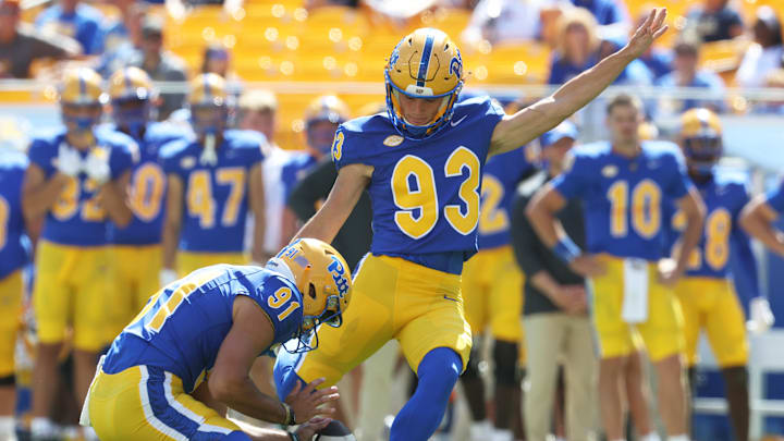 Aug 30, 2025; Pittsburgh, Pennsylvania, USA; Pittsburgh Panthers place kicker Trey Butkowski (93) kicks a field goal from the hold of punter Caleb Junko (91) against the Duquesne Dukes during the fourth quarter at Acrisure Stadium. Mandatory Credit: Charles LeClaire-Imagn Images
