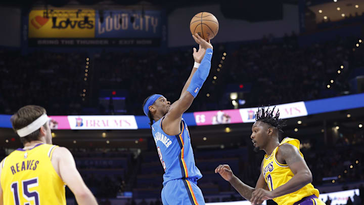 Apr 8, 2025; Oklahoma City, Oklahoma, USA; Oklahoma City Thunder guard Shai Gilgeous-Alexander (2) shoots over Los Angeles Lakers forward Dorian Finney-Smith (17) during the second half at Paycom Center. Mandatory Credit: Alonzo Adams-Imagn Images