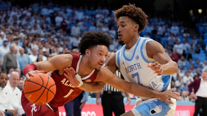 Alabama guard Mark Sears drives with the ball as North Carolina guard Seth Trimble defends.