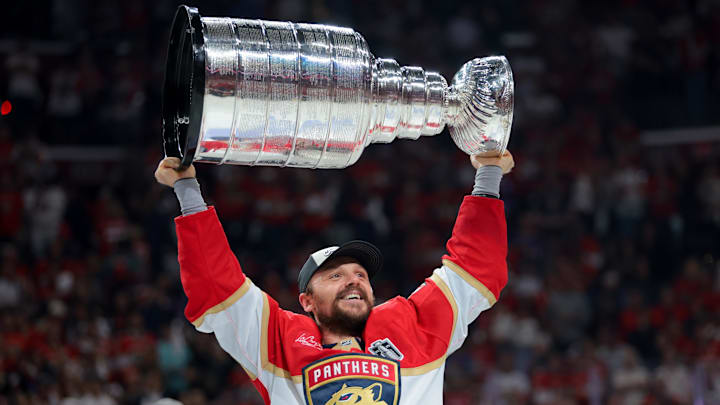 Jun 17, 2025; Sunrise, Florida, USA; Florida Panthers center Sam Reinhart (13) hoists the Stanley Cup after winning game six of the 2025 Stanley Cup Final against the Edmonton Oilers at Amerant Bank Arena. Mandatory Credit: Sam Navarro-Imagn Images Jun 17, 2025; Sunrise, Florida, USA; Florida Panthers center Sam Reinhart (13) hoists the Stanley Cup after winning game six of the 2025 Stanley Cup Final against the Edmonton Oilers at Amerant Bank Arena. Mandatory Credit: Sam Navarro-Imagn Images