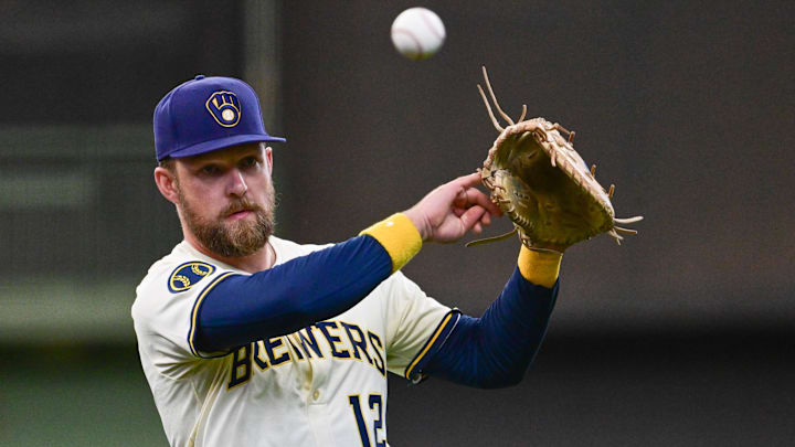 Jun 9, 2025: Milwaukee Brewers first baseman Rhys Hoskins (12) warms up before game against the Atlanta Braves at American Family Field. 