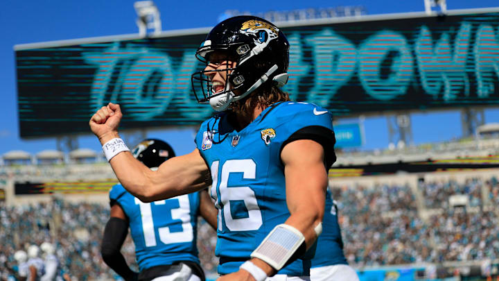 Jacksonville Jaguars quarterback Trevor Lawrence (16) celebrates his pass for a touchdown score to