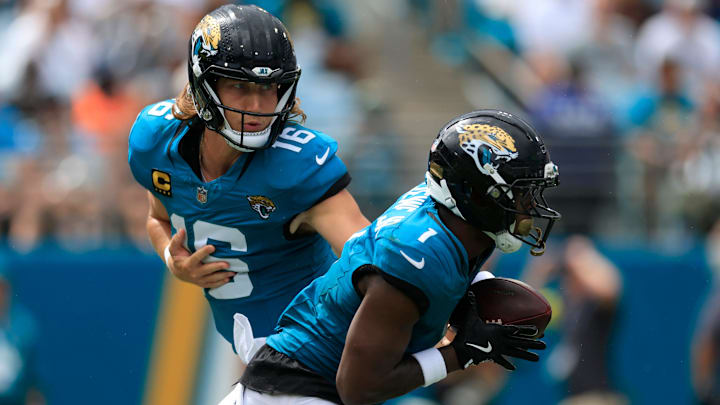Jacksonville Jaguars quarterback Trevor Lawrence (16) hands off to Jacksonville Jaguars running back Travis Etienne Jr. (1) during the second quarter of an NFL football matchup at EverBank Stadium, Sunday, Sept. 7, 2025 in Jacksonville, Fla. 