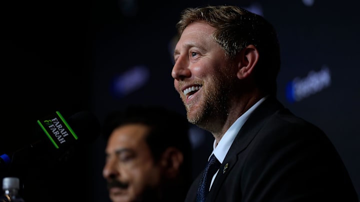New Jacksonville Jaguars head coach, Liam Coen, smiles next to Jaguars owner Shad Khan after speaking and being introduced during a press conference Monday, Jan. 27, 2025 at the Miller Electric Center in Jacksonville, Fla. New Jacksonville Jaguars head coach, Liam Coen, smiles next to Jaguars owner Shad Khan after speaking and being introduced during a press conference Monday, Jan. 27, 2025 at the Miller Electric Center in Jacksonville, Fla.