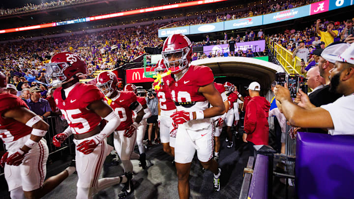 Nov 9, 2024; Baton Rouge, Louisiana, USA; Alabama Crimson Tide players run onto the field before their game against the LSU Tigers at Tiger Stadium. Mandatory Credit: Stephen Lew-Imagn Images Nov 9, 2024; Baton Rouge, Louisiana, USA; Alabama Crimson Tide players run onto the field before their game against the LSU Tigers at Tiger Stadium. Mandatory Credit: Stephen Lew-Imagn Images