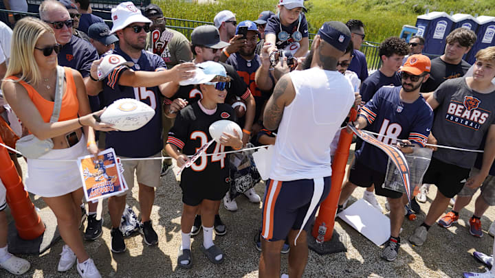 Bears fans at Halas Hall for training camp flock around wide receiver Keenan Allen for autographs. Bears fans at Halas Hall for training camp flock around wide receiver Keenan Allen for autographs.