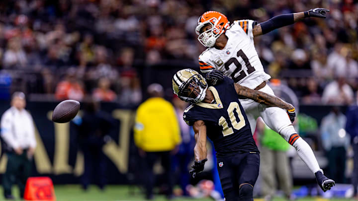 Nov 17, 2024; New Orleans, Louisiana, USA;  Cleveland Browns cornerback Denzel Ward (21) blocks a pass intended for New Orleans Saints wide receiver Marquez Valdes-Scantling (10) during the second half at Caesars Superdome. Mandatory Credit: Stephen Lew-Imagn Images
