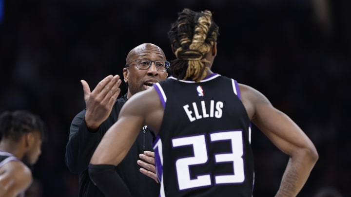 Apr 9, 2024; Oklahoma City, Oklahoma, USA; Sacramento Kings head coach Mike Brown talks to guard Keon Ellis (23) during a break in play during the second half at Paycom Center. Mandatory Credit: Alonzo Adams-USA TODAY Sports