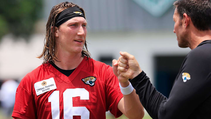 Jacksonville Jaguars quarterback Trevor Lawrence (16) fist bumps executive vice president of football operations Tony Boselli during the first organized team activity at Miller Electric Center Monday, May 19, 2025 in Jacksonville, Fla. Jacksonville Jaguars quarterback Trevor Lawrence (16) fist bumps executive vice president of football operations Tony Boselli during the first organized team activity at Miller Electric Center Monday, May 19, 2025 in Jacksonville, Fla.