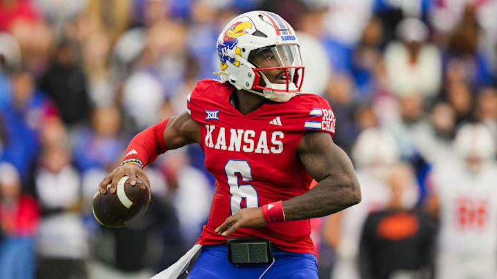 Nov 1, 2025; Lawrence, Kansas, USA; Kansas Jayhawks quarterback Jalon Daniels (6) throws a pass during the first half against the Oklahoma State Cowboys at David Booth Kansas Memorial Stadium. Mandatory Credit: Jay Biggerstaff-Imagn Images