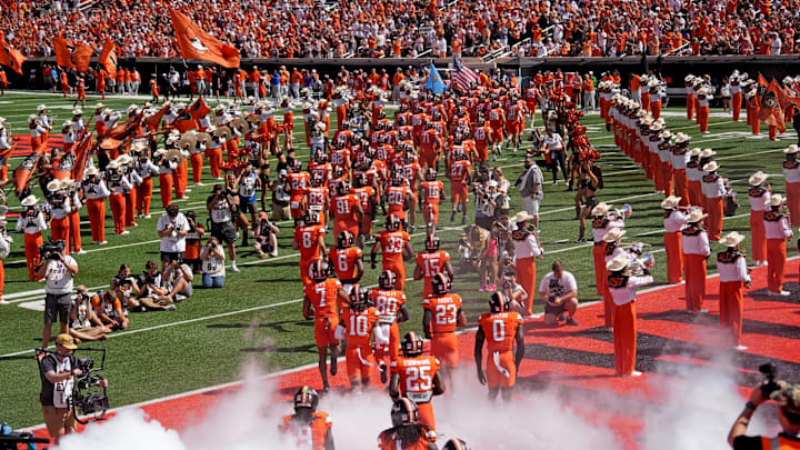 Oklahoma State runs on to the field in the first half of the college football between the Oklahoma State University Cowboys and the Utah Utes at Boone Pickens Stadium in Stillwater, Okla., Saturday, Sept., 21, 2024.
