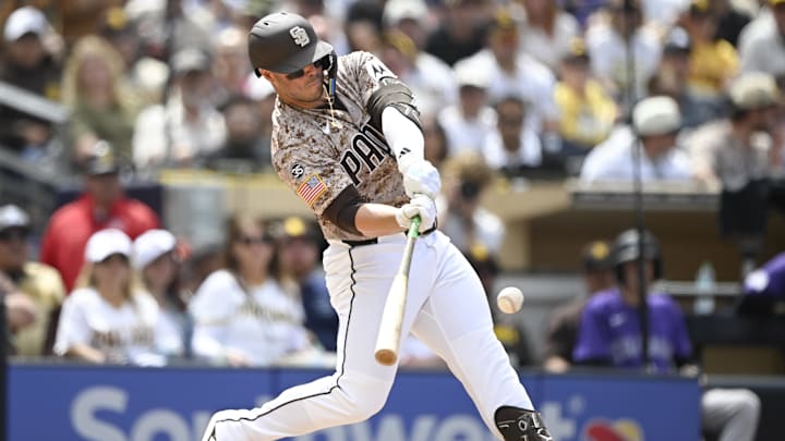 Apr 12, 2026; San Diego, California, USA; San Diego Padres first baseman Ty France (25) hits a solo home run during the fourth inning against the Colorado Rockies at Petco Park. Mandatory Credit: Denis Poroy-Imagn Images