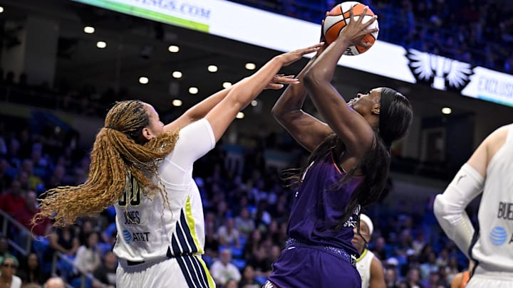 Sep 11, 2025; Arlington, Texas, USA; Phoenix Mercury center Kalani Brown (21) shoots the ball over Dallas Wings guard Haley Jones (30) during the second half at College Park Center. Mandatory Credit: Jerome Miron-Imagn Images
