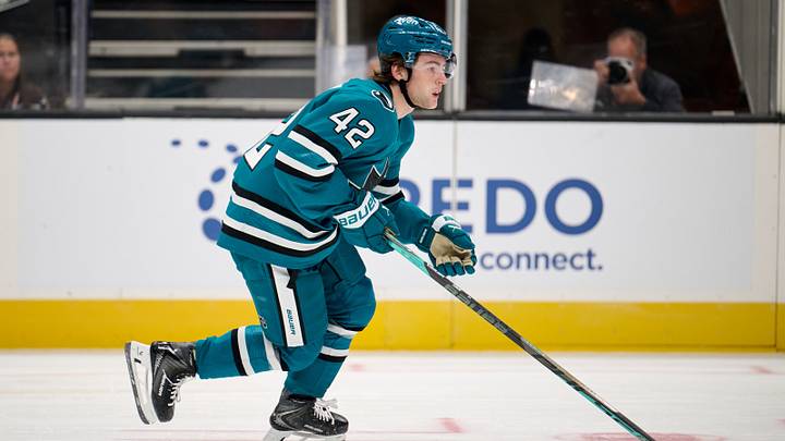 Sep 24, 2026; San Jose, California, USA; San Jose Sharks defenseman Luca Cagnoni (42) plays the puck against the Anaheim Ducks during the first period at SAP Center at San Jose. Mandatory Credit: Robert Edwards-Imagn Images