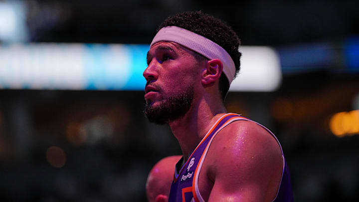 Apr 23, 2024; Minneapolis, Minnesota, USA; Phoenix Suns guard Devin Booker (1) walks back to the