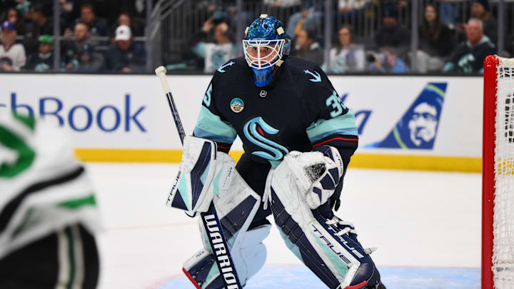 Mar 30, 2024; Seattle, Washington, USA; Seattle Kraken goaltender Joey Daccord (35) defends the goal against the Dallas Stars during the first period at Climate Pledge Arena. Mandatory Credit: Steven Bisig-Imagn Images