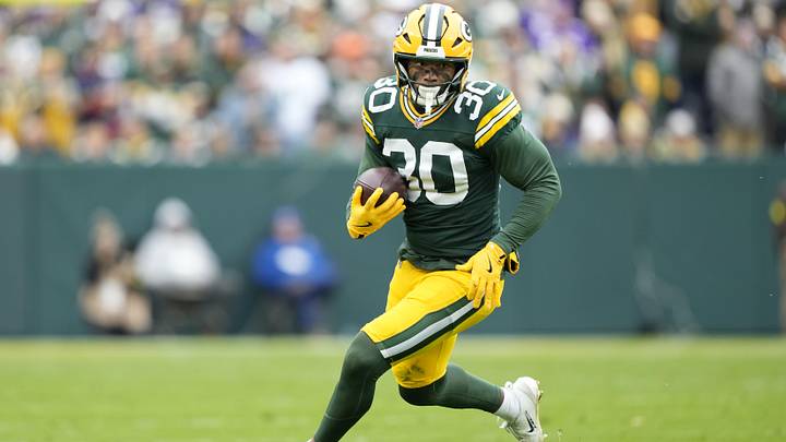 Nov 23, 2025; Green Bay, Wisconsin, USA; Green Bay Packers running back Chris Brooks (30) runs after the catch against the Minnesota Vikings during the first half at Lambeau Field. Mandatory Credit: Kayla Wolf-Imagn Images