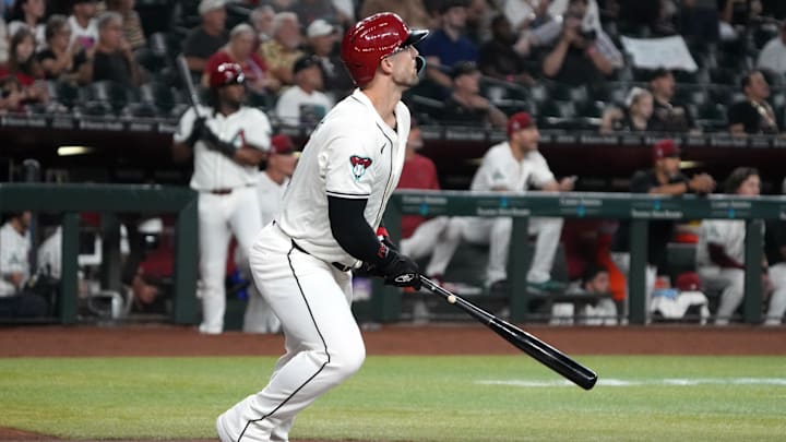 Sep 11, 2024; Phoenix, Arizona, USA; Arizona Diamondbacks outfielder Randal Grichuk (15) hits a two-run home run and 200th of his career against the Texas Rangers in the first inning at Chase Field. Mandatory Credit: Rick Scuteri-Imagn Images Sep 11, 2024; Phoenix, Arizona, USA; Arizona Diamondbacks outfielder Randal Grichuk (15) hits a two-run home run and 200th of his career against the Texas Rangers in the first inning at Chase Field. Mandatory Credit: Rick Scuteri-Imagn Images