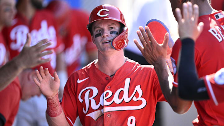 Aug 23, 2023; Anaheim, California, USA; Cincinnati Reds second baseman Matt McLain (9) is congratulated in the dugout after scoring a run against the Los Angeles Angels during the ninth inning at Angel Stadium. Mandatory Credit: Orlando Ramirez-Imagn Images