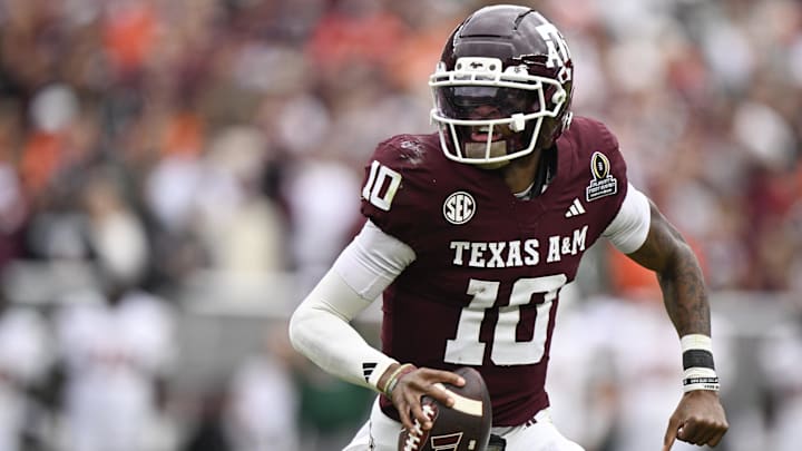 Dec 20, 2025; College Station, TX, USA; Texas A&M Aggies quarterback Marcel Reed (10) runs the ball against the Miami Hurricanes during first half of the first round game of the CFP National Playoff at Kyle Field. Mandatory Credit: Jerome Miron-Imagn Images