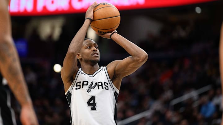 Feb 10, 2025; Washington, District of Columbia, USA; San Antonio Spurs guard De'Aaron Fox (4) shoots a free throw during the fourth quarter against the Washington Wizards at Capital One Arena. Mandatory Credit: Reggie Hildred-Imagn Images