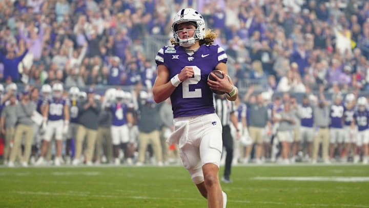 Kansas State quarterback Avery Johnson (2) scores a touchdown against Rutgers during first half of the Rate Bowl at Chase Field on Dec. 26, 2024, in Phoenix. Kansas State quarterback Avery Johnson (2) scores a touchdown against Rutgers during first half of the Rate Bowl at Chase Field on Dec. 26, 2024, in Phoenix.