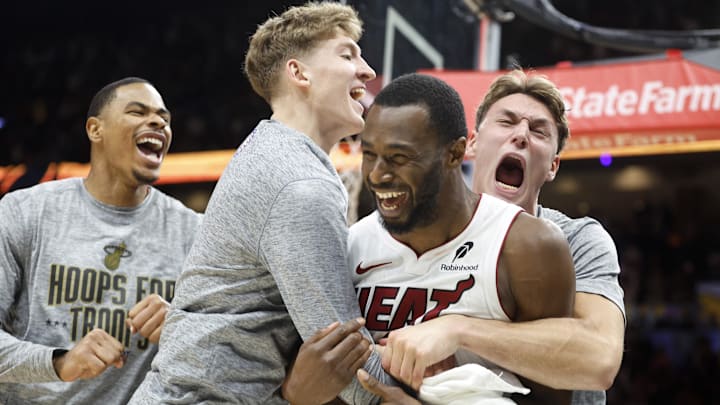 Nov 10, 2025; Miami, Florida, USA;  Miami Heat forward Andrew Wiggins (22) reacts to winning the game with teammates against the Cleveland Cavaliers during overtime at Kaseya Center. Mandatory Credit: Rhona Wise-Imagn Images
