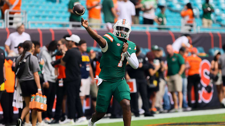 Nov 2, 2024; Miami Gardens, Florida, USA; Miami Hurricanes quarterback Cam Ward (1) throws the football before the game against the Duke Blue Devils at Hard Rock Stadium. Mandatory Credit: Sam Navarro-Imagn Images