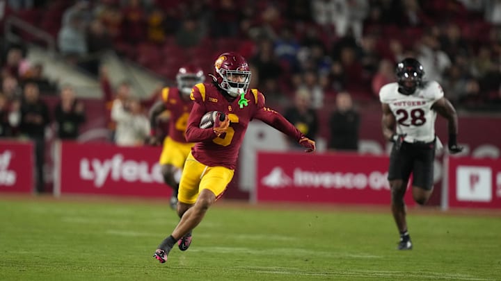 Oct 25, 2024; Los Angeles, California, USA; Southern California Trojans wide receiver Makai Lemon (6) carries the ball on a 70-yard reception against the Rutgers Scarlet Knights in the second half at United Airlines Field at Los Angeles Memorial Coliseum. Mandatory Credit: Kirby Lee-Imagn Images