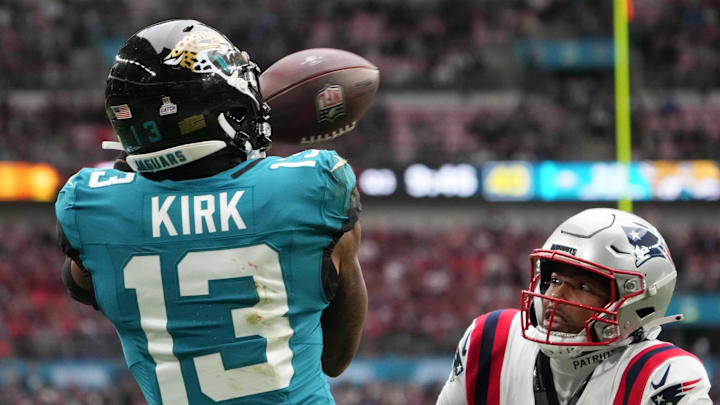 Oct 20, 2024; London, United Kingdom; Jacksonville Jaguars wide receiver Christian Kirk (13) attempts to catch the ball against New England Patriots cornerback Marcus Jones (25) in the second half of an NFL International Series game at Wembley Stadium. Mandatory Credit: Kirby Lee-Imagn Images Oct 20, 2024; London, United Kingdom; Jacksonville Jaguars wide receiver Christian Kirk (13) attempts to catch the ball against New England Patriots cornerback Marcus Jones (25) in the second half of an NFL International Series game at Wembley Stadium. Mandatory Credit: Kirby Lee-Imagn Images