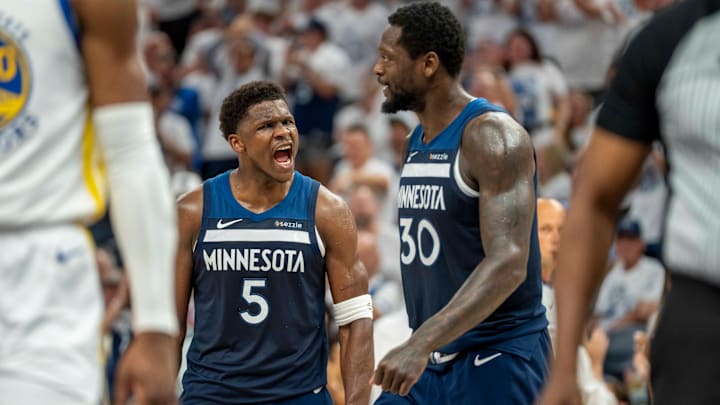 Minnesota Timberwolves guard Anthony Edwards (5) celebrates with forward Julius Randle after making a shot against the Golden State Warriors in the first half during Game 5 of their Western Conference semifinal at Target Center in Minneapolis on May 14, 2025. 