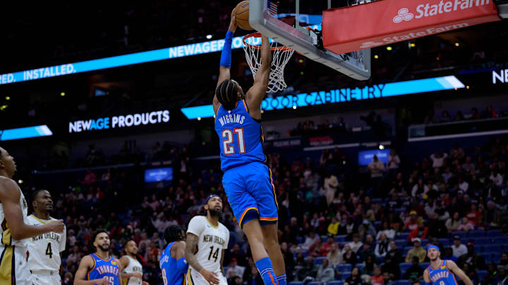 Dec 7, 2024; New Orleans, Louisiana, USA;  Oklahoma City Thunder guard Aaron Wiggins (21) dunks against the Oklahoma City Thunder during the first half at Smoothie King Center. Mandatory Credit: Matthew Hinton-Imagn Images