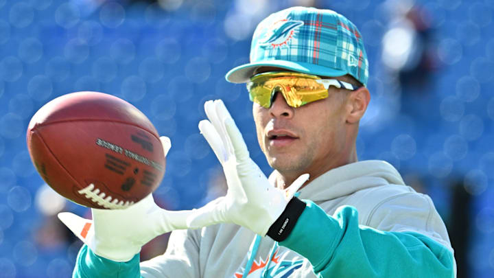 Miami Dolphins safety Jordan Poyer (21) warms up before a game against the Buffalo Bills at Highmark Stadium.