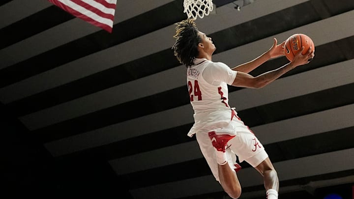 The University of Alabama unveiled the first banner honoring the school’s first Final Four appearance Friday, Oct. 11, 2024, in Coleman Coliseum. Alabama forward Naasir Cunningham (24) participates in the dunk contest.