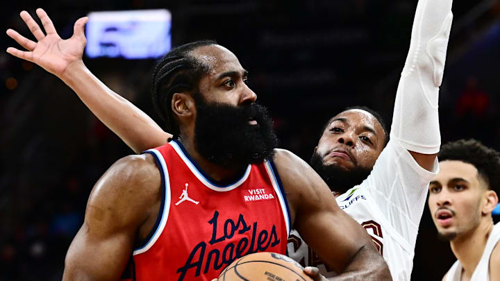 Nov 23, 2025; Cleveland, Ohio, USA; Los Angeles Clippers guard James Harden (1) drives to the basket against Cleveland Cavaliers guard Darius Garland (10) during the second half at Rocket Arena. Mandatory Credit: Ken Blaze-Imagn Images