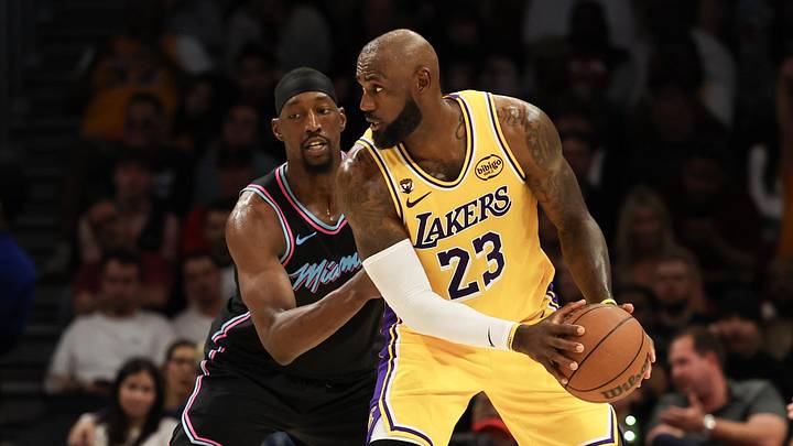 Mar 19, 2026; Miami, Florida, USA; Miami Heat center Bam Adebayo (13) defends Los Angeles Lakers forward LeBron James (23) during second half at Kaseya Center. Mandatory Credit: Isabella Frias-Imagn Images