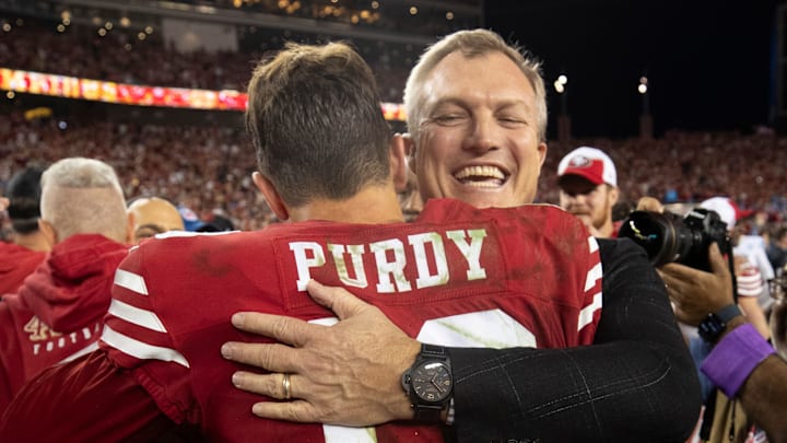 San Francisco 49ers quarterback Brock Purdy (L) and general manager John Lynch (R)
