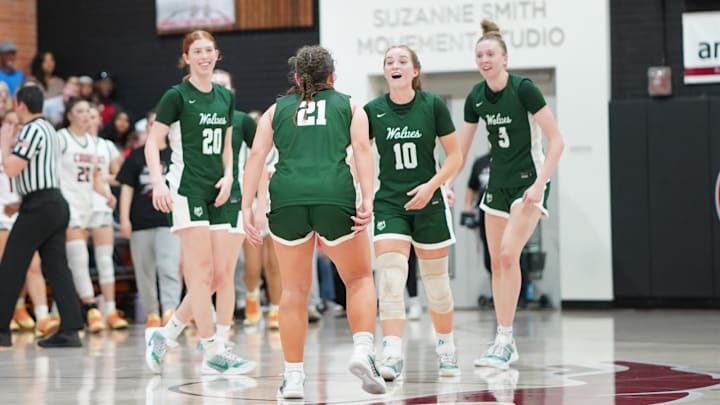 San Ramon Valley High School's girls basketball team finally celebrate in the final 10 seconds of their 51-44 win at Carondelet March 4 in the CIF Northern California Open Division first-round game just four days after being beat by the same Cougars for the North Coast Section Open championship. 
