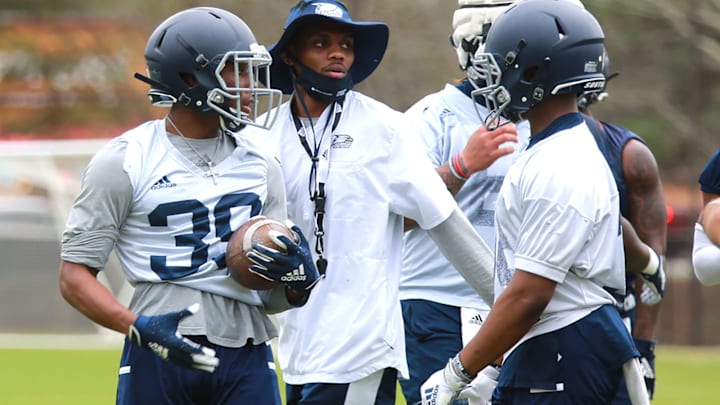 Georgia Southern running back coach Favian Upshaw works with players during a drill. Upshaw was a quarterback for the Eagles and MVP of the 2015 GoDaddy Bowl.