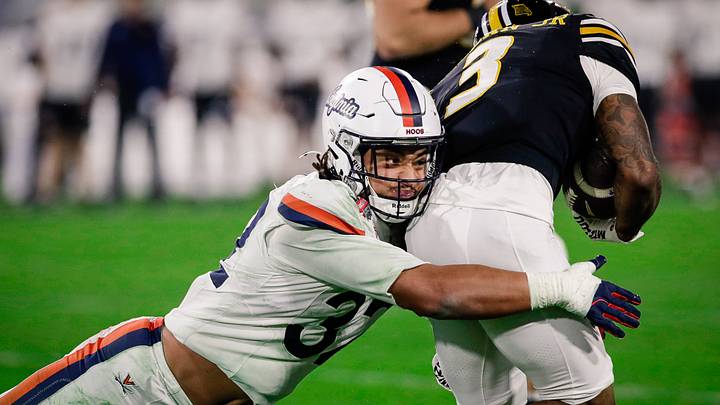 Dec 27, 2025; Jacksonville, FL, USA; Virginia Cavaliers linebacker Landon Danley (32) makes a tackle against the Missouri Tigers during the third quarter at EverBank Stadium. Mandatory Credit: Travis Register-Imagn Images