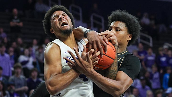 Kansas State guard P.J. Haggerty (left) and UCF forward Jamichael Stillwell fight for the ball during the second half at Bramlage Coliseum. 