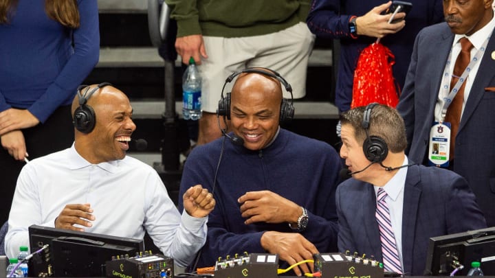Former Auburn basketball player Charles Barkley jokes with announcers Jay Williams, left, and Roxy