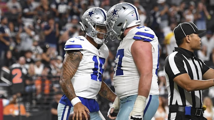 Aug 17, 2024; Paradise, Nevada, USA; Dallas Cowboys quarterback Trey Lance (19) celebrates his touchdown with center Brock Hoffman (67) against the Las Vegas Raiders in the fourth quarter at Allegiant Stadium. Mandatory Credit: Candice Ward-Imagn Images