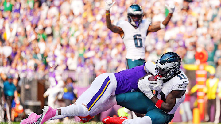 Oct 19, 2025; Minneapolis, Minnesota, USA; Philadelphia Eagles wide receiver A.J. Brown (11) scores a touchdown during the second half against the Minnesota Vikings at U.S. Bank Stadium.